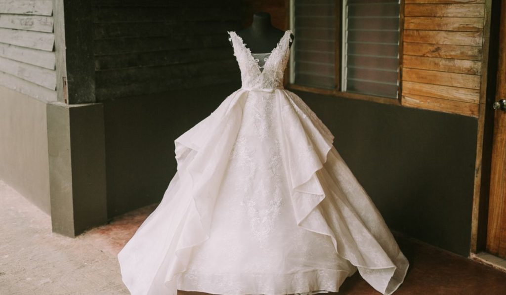 White lace ball gown wedding dress on a mannequin — professional wedding gown preservation and cleaning service on Long Island